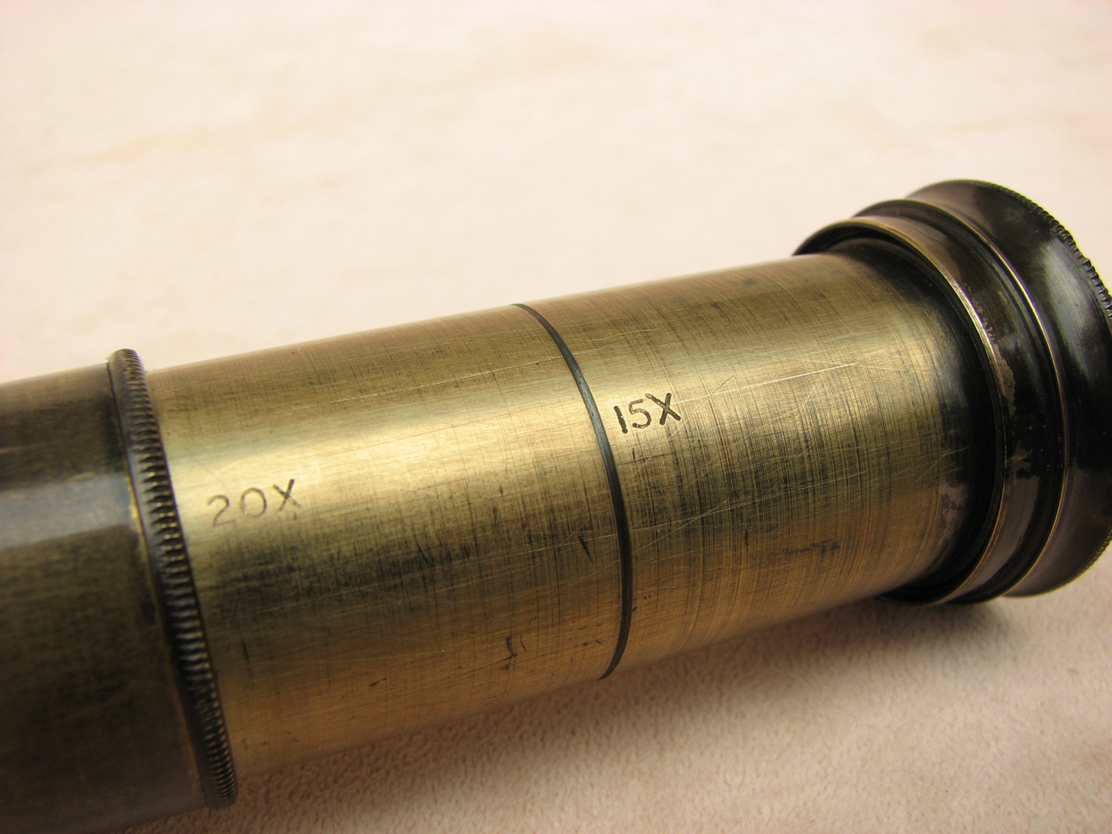 3 draw leather clad pocket telescope with pancratic tube to 20x magnification.